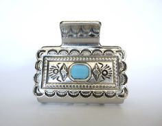 Hair claw clip turquoise blue stone western design metal rectangle shape
This is a silver metal hair clip with turquoise colored stones.

Clip measures 2 inches long.

Hair claw is wide and can hold a lot of hair. Western Claw Clips, Metal Hair Clip, Metal Hair Clips, Hair Claw Clip, Metal Hair, Colored Stones, Western Design, Claw Clips, Metallic Hair