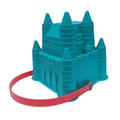 a blue plastic sand castle with a red handle on the front and side, set against a white background