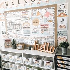 a bulletin board with the word hello written on it in front of several bins