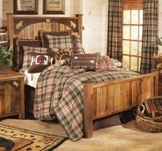 a bed with plaid comforter and pillows in a rustic style bedroom, next to a window