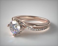 a white gold engagement ring set with an oval cut diamond