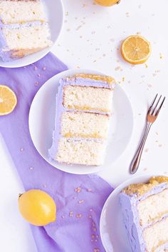 two slices of cake on plates with forks and lemons next to the rest of the cake