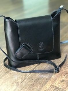 A beautiful unique design for dress or casual. This structured leather purse made in Italy is classy, roomy and secure with magnetic flap closure. The wide bottom creates a roomy bag that easily accommodates wallet, sunglasses, cell phones and other essentials. #italianleatherhandbags #italianleatherbag #leatherhandbags #crossbodypurses #shoulderbags #giftideas #giftforher #giftsforfriends #blackbag #pursesandbags Design For Dress, Structured Handbags, Italian Leather Handbags, Italian Leather Bags, Unique Purses, How To Make Handbags, Leather Cross, Leather Messenger Bag, Florence Italy