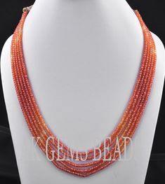 PRODUCT DETAILS: AAA Orange Shaded Cubic Zirconia 5 Strand Faceted Rondelle Beaded Necklace Jewelry Stone Name :- Cubic Zirconia ( Light Orange and Dark Orange ) Bead Size :- 3mm Length :- 13 to 15 Inches Bead Shape :- Rondelle Bead Type :- Faceted Quality :- AAA (Excellent) Treatment :- Natural 2. NECKLACE LENGTHS :- 1st Strands :- 13 Inches 2nd Strands :- 13.5 Inches 3rd Strands :- 14 Inches 4th Strands :- 14.5 inches 5th Strands :- 15 inches More Fine Shop Gemstones Gemstone Cubic Zirconia Ne Multistrand Necklaces, Necklace Orange, Gemstone Beads Wholesale, Pearl Jewelry Design, Orange Necklace, Gemstone Beads Jewelry, Gold Designs, Semi Precious Jewelry