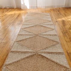 a rug on the floor in front of a window