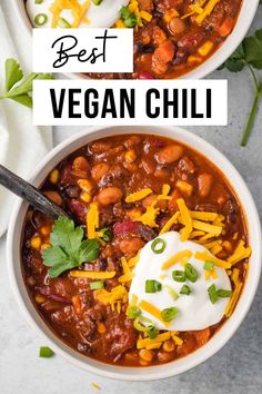 two bowls filled with chili, beans and cheese