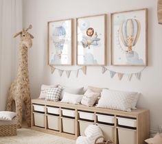 a baby's room with stuffed animals and pictures on the wall