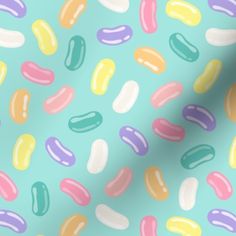 an abstract pattern with pastel colors on a light blue background that resembles jelly beans