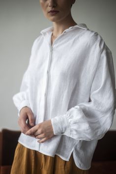 Pure linen puff long sleeves linen shirt features collar neck and has loose relaxed fit. All seasons fully button up front blouse perfect for work or as casual everyday wear. Classic oversize fit gives you freedom of movement with elegance and femininity. Fabric: Composition: 100% soft linen The linen is known for its iconic raw texture and airy natural feel that keeps you cool during the warm seasons. It is durable and comfortable. How to care: ・Turn the garments inside-out before washing ・Mach Linen Long Sleeve Top With Gathered Sleeves, Classic Oversized Linen Blouse, White Linen Shirts Women, Clothing Exchange, Raw Texture, Flax Clothing, White Linen Blouse, Sleeves Women, Linen Shirts Women