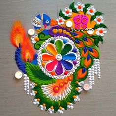 an artistic design on the floor for diwaling with colorful flowers and fish in it