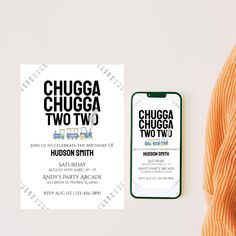 the chicago two two wedding stationery is displayed next to an orange robe and phone