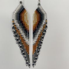 These earrings are stunning. They create movement with each step, a hint of shimmer strategically placed adds a dramatic effect. Dress up or casual. These hand beaded fringe earrings remind me of a majestic owl or bird of prey.  Make a bold statement with these beautiful wing patterned earrings.  5" in length Fringe Beaded Earrings, Bead Fringe Earrings, Bead Fringe, Native American Beaded Earrings, Bird Of Prey, Owl Bird, Native American Beading