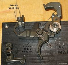 the parts of a sewing machine are labeled in this image, including an arm and foot