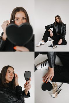 a woman sitting on the floor holding a heart shaped mirror