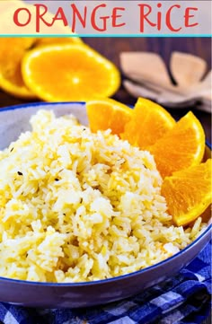 orange rice in a bowl with sliced oranges on the side