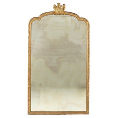 an ornately decorated mirror on a white background