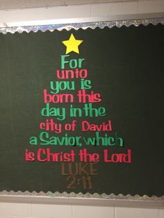 a christmas tree made out of paper with the words for unto you're born this day in the city of david