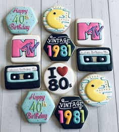 decorated cookies arranged in the shape of cassettes with numbers, age and birthday messages