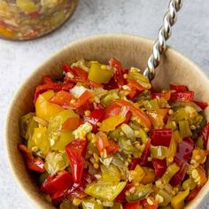 a wooden bowl filled with chopped bell peppers