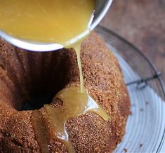 a bundt cake is being drizzled with caramel sauce on top