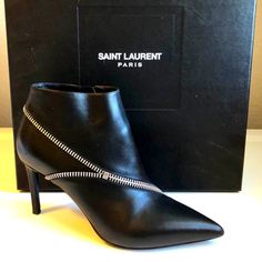 Beautiful & Sophisticated Saint Laurent Paris Ysl Nero Ankle Boots With Box & Dust Cover Bag No One Makes Leather Goods As Well As The Italians So These Elegant Boots Are Bellissimo! Handcrafted In The Finest Kid Leather (Sheepskin) With Artful Silver Metal Zipper Accents, And Finished Off With A Sexy Pointed Toe And Stiletto Heel! ... Msrp $1395 Made In Italy Size: It/Eu 37 1/2 = Us 7 Color Black Genuine Kid Leather (Sheepskin) Ankle Boots 3"H Stiletto Heels Pointed Toe Silver Metal Accents Ins Ysl Saint Laurent, Elegant Boots, Yves Saint Laurent Shoes, Saint Laurent Paris, Heel Caps, Metal Accents, Metal Zipper, Silver Accents, Dust Cover