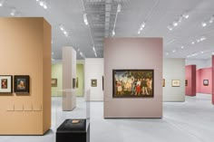 an art gallery with paintings on the walls