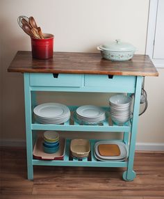 a kitchen island with plates and pans on it