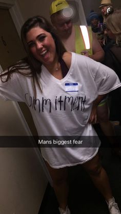 a woman wearing a white shirt with the words, human is biggest fear on it