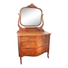 an antique wooden dresser with mirror on top