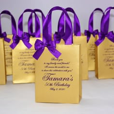 small gold bags with purple ribbon tied around them for guests to take home from the ceremony