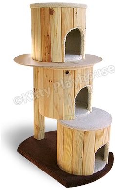 a wooden cat house with two towers and one door on the top, which is made out of wood