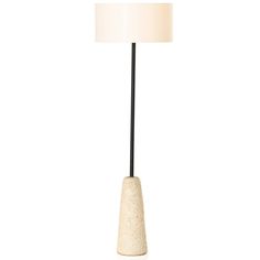 a lamp that is on top of a white surface with a black base and a light shade