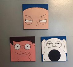 three square paintings with cartoon faces on them