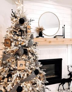 a decorated christmas tree with black and white ornaments