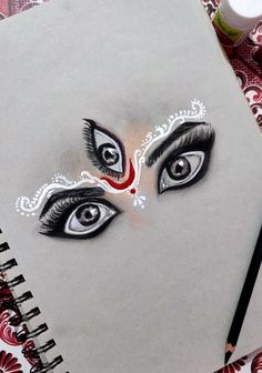 a drawing of a woman's face with eyes painted on it