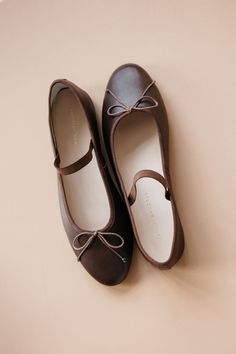 Soft ballet flat in chocolate brown Italian glove calf leather with an elastic bridge strap and bow detail. Features a padded footbed with gold stamped logo and an almond toe. Ballet Flats For Women, Chic Brown Ballet Flats With Round Toe, Elegant Brown Ballet Flats With Round Toe, Chic Brown Round Toe Ballet Flats, Elegant Brown Round Toe Ballet Flats, Brown Ballet Flats With Bow, Formal Brown Ballet Flats With Flat Heel, Brown Ballet Flats With Branded Insole And Round Toe, Brown Ballet Flats With Comfortable Insole And Round Toe