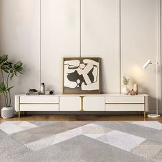 a modern living room with white walls and wood flooring, an abstract painting on the wall