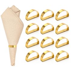 a set of twelve gold napkin holders next to each other