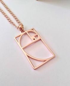 ★ Fibonacci Pendant ★ A beautiful handcrafted Fibonacci (Golden Ratio) pendant/necklace for Men and Women. * Materials/Finishes ➤ Silver 925 (Sterling Silver) ➤ 24K Gold Plated over Silver 925 ➤ 14K Rose Gold Plated over Silver 925 * Dimensions ➤ 3.5 x 2.0 x 1.0 cm (~ 1.4 x 0.8 x 0.4 inches)/Bail: Suitable for up to 3.00 mm (~ 0.1 inches) * Weight: ~ 5 grams (in Silver 925) ----------------------------------------------------------------------------- IMPORTANT NOTES: ---------------------------- Spiral Rose Gold Jewelry Gift, Golden Ratio Jewelry, Fibonacci Stone, Fibonacci Series, Golden Ratio Necklace, Gold Geometric Nickel-free Jewelry, Fibonacci Necklace, Fibonacci Indicator, Raven Skull Necklace