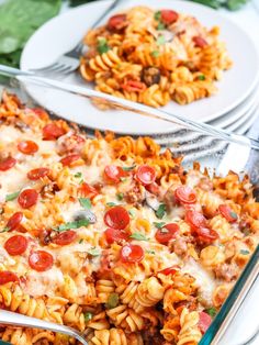 a casserole dish filled with pasta and meat