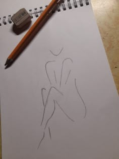 a drawing of a woman's torso with a pencil next to it