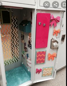 a white locker with many magnets and bows on it