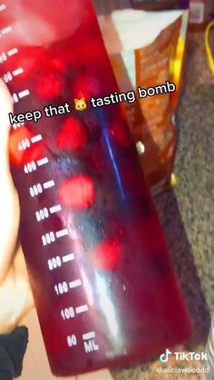 a person holding a red blender in their hand with the words keep that 8 tasting bomb on it