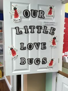 a door decorated with magnets that says our little love bugs