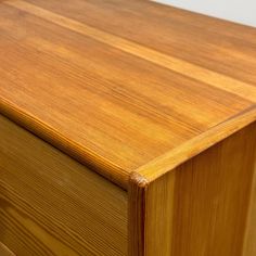 a close up view of a wooden dresser