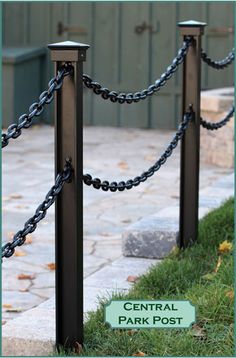 an image of a metal post with chains on it