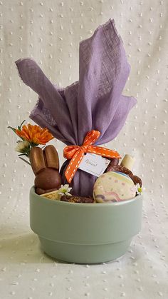 a bowl filled with assorted treats on top of a table