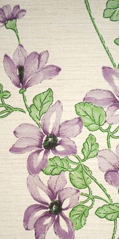 purple flowers on white fabric with green leaves and stems in the center, closeup