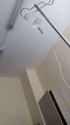 an overhead view of a kitchen with a refrigerator and light fixture in the middle of it