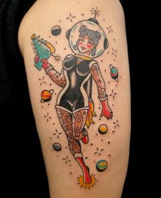 a woman with an astronaut's helmet on her head and body is depicted in this tattoo